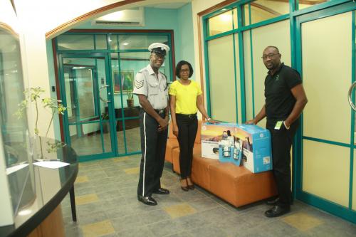 ASQUITH MAPP-FINANCE AND MARCIA THOMPSON OF CORPORATE WITH RODNEY SWIFT OF THE LAYOU POLICE STATION (1)